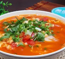 Tomato and egg stir-fried noodle with knife-cut noodles
