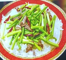 Stir-fried Beef with Garlic Shoots over Rice