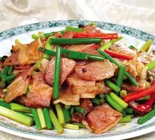 Stir-Fried Garlic Shoots with Preserved Meat over Rice