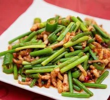 Stir-fried Garlic Shoots with Pork over Rice